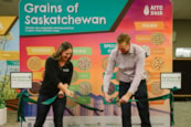 A ribbon is cut to officially launch the new Grains of Saskatchewan display by AITC-SK.